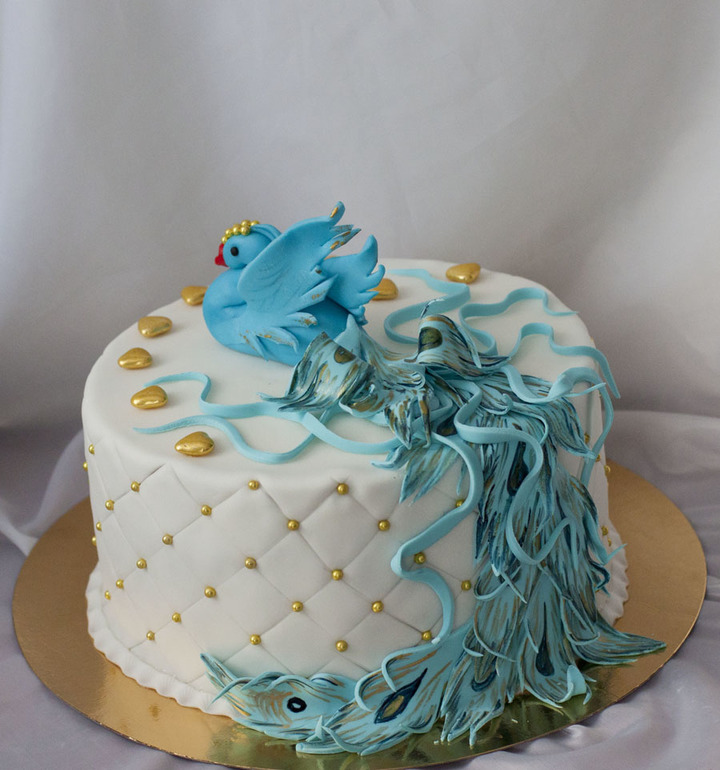 На юбилей для женщины птицу удачи.