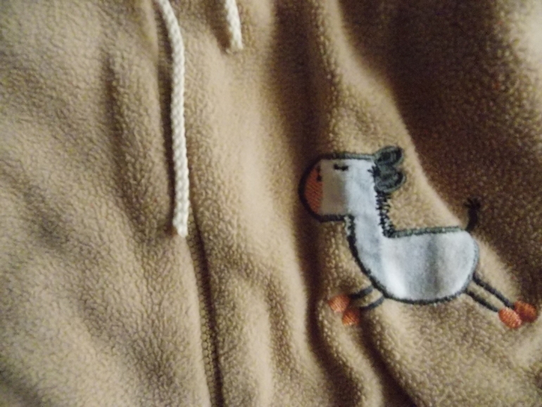 Много разной одежды для мальчика.