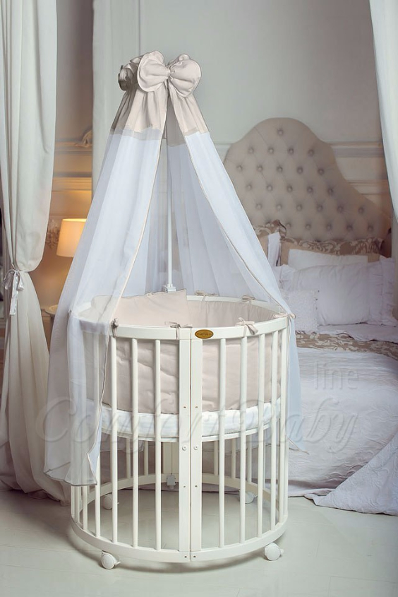 КРОВАТКА- ТРАНСФОРМЕР "COMFORT BABY" .Цена: 25 000 руб.  ХАРАКТЕРИСТИКИ:  возраст детей: 0-5 лет  габариты модели (Д х Ш х В): 1) колыбельки: 78*76*81 см  2) овальной кроватки: 128*76*81 cм  матрас приобретается отдельно.  максимальная нагрузка: 120 кг  Материал: изготавливается только из настоящего массива бука высшего сорта.  сборка: кровать в разобранном виде, простота сборки, инструкция по сборке на русском языке  продукция сертифицирована  производство: Россия  гарантия: 2 года   Дополнительные характеристики: 4 положения по высоте (расстояние положения дна от пола без колес: 1см, 12см, 37см, 57см; расстояние между отверстиями снизу-наверх: 12см, 15см, 20см.); 3 прутика - съемные.  КОНМПЛЕКТАЦИЯ:  1-я ступень - круглая кроватка  2-я ступень - овальная кроватка  3-я ступень - диванчик  4-я ступень - манеж  5-я и 6-я ступени - 2 кресла и столик  7-я ступень - пеленальный столик  ДОПОЛНИТЕЛЬНЫЕ ОПЦИИ:  Комплект постельный "Classic" +6950 руб.  Комплект постельный "Colorit" + 11990 руб.  Фирменный держатель для балдахина +790 руб.  Комплект цельных матрасов " Холкон"/ "Кокос" (круглый+овальный) +8490 руб  Маятник "ComfortBaby Pendulum" 2 в 1+6990 руб.